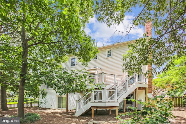 21130 Haystack Ct, Ashburn, VA 20147 - back of property with stairs, a wooden deck, and a chimney