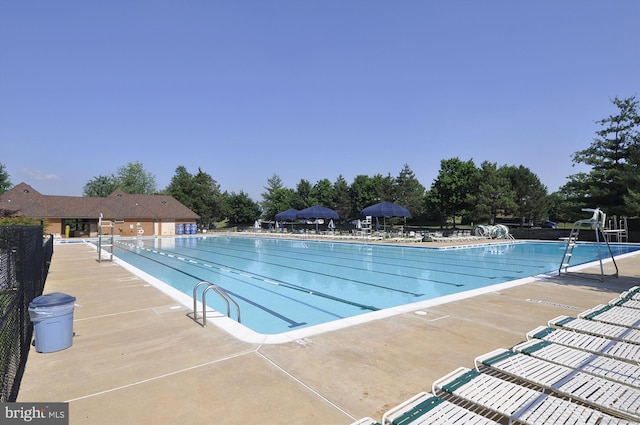 21130 Haystack Ct, Ashburn, VA 20147 - community pool featuring a patio