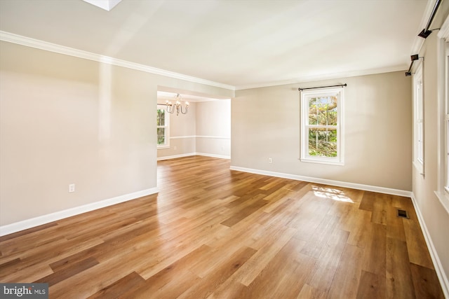 21130 Haystack Ct, Ashburn, VA 20147 - unfurnished room featuring a chandelier, crown molding, baseboards, and light wood-style floors