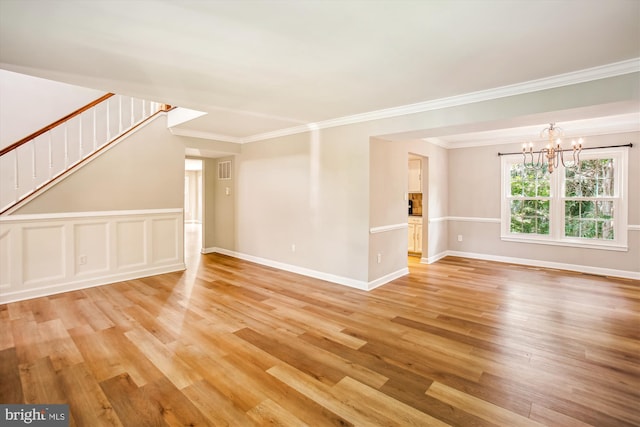 21130 Haystack Ct, Ashburn, VA 20147 - unfurnished living room with light wood-type flooring, a chandelier, crown molding, stairway, and baseboards
