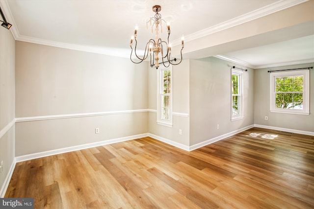 21130 Haystack Ct, Ashburn, VA 20147 - empty room featuring a chandelier, healthy amount of natural light, baseboards, wood finished floors, and ornamental molding