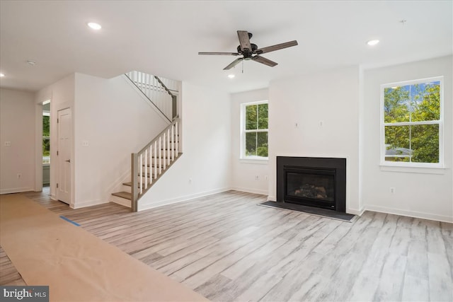 9842 Fire Tower Rd, Ijamsville, MD 21754 - unfurnished living room with stairs, wood finished floors, recessed lighting, baseboards, and ceiling fan