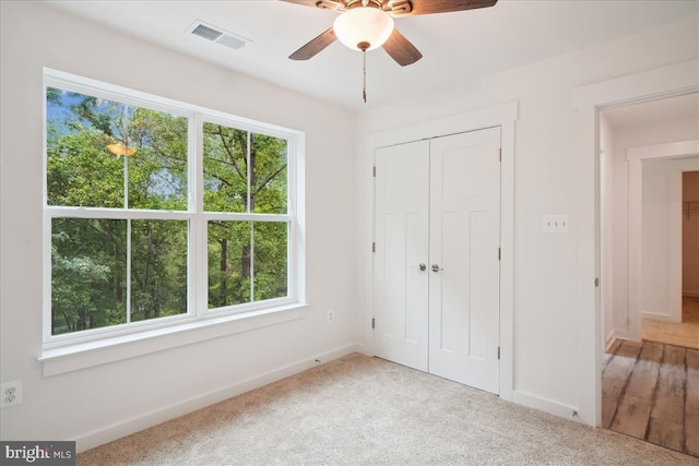 9842 Fire Tower Rd, Ijamsville, MD 21754 - unfurnished bedroom with baseboards, carpet flooring, a closet, and ceiling fan