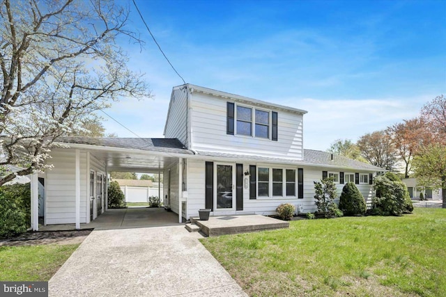 18 Oak Landing Rd, Lumberton, NJ 08048 - traditional-style home with driveway, a front yard, roof with shingles, and an attached carport