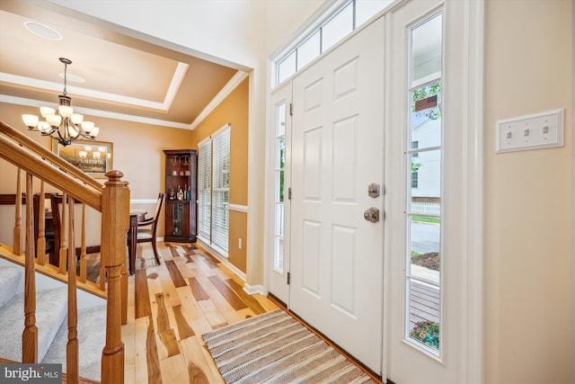 502 Leaning Oak St, Gaithersburg, MD 20878 - foyer featuring a chandelier, healthy amount of natural light, crown molding, light wood-style floors, and stairway