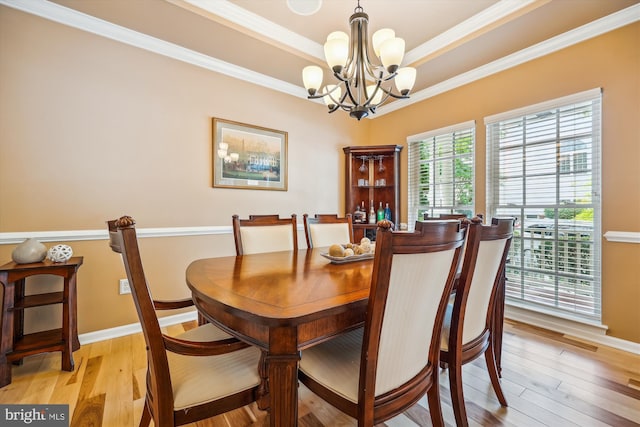 502 Leaning Oak St, Gaithersburg, MD 20878 - dining room featuring a chandelier, a tray ceiling, light wood-type flooring, ornamental molding, and baseboards