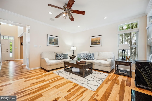 502 Leaning Oak St, Gaithersburg, MD 20878 - living area with light wood finished floors, ornamental molding, plenty of natural light, ceiling fan, and recessed lighting