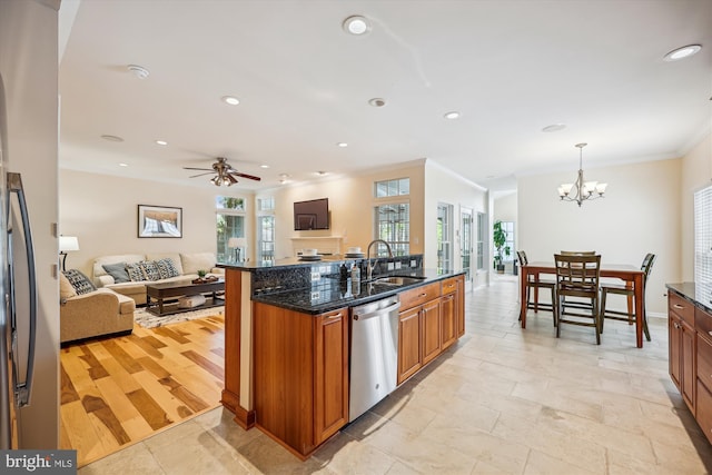 502 Leaning Oak St, Gaithersburg, MD 20878 - kitchen with a sink, stainless steel appliances, open floor plan, ornamental molding, and brown cabinetry