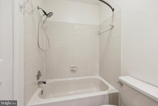 bathroom with toilet and shower / bath combination