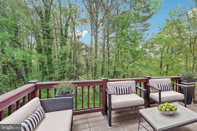 wooden deck featuring an outdoor living space