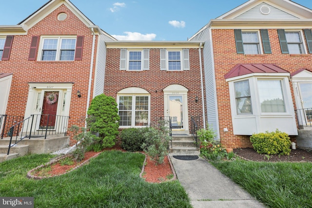 view of property featuring brick siding