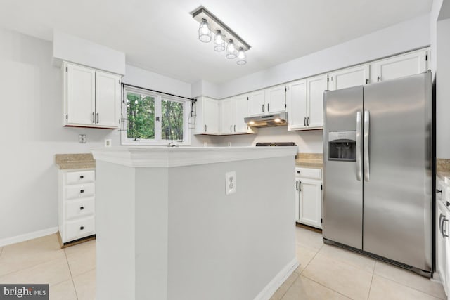 kitchen with white cabinetry, stainless steel refrigerator with ice dispenser, and under cabinet range hood