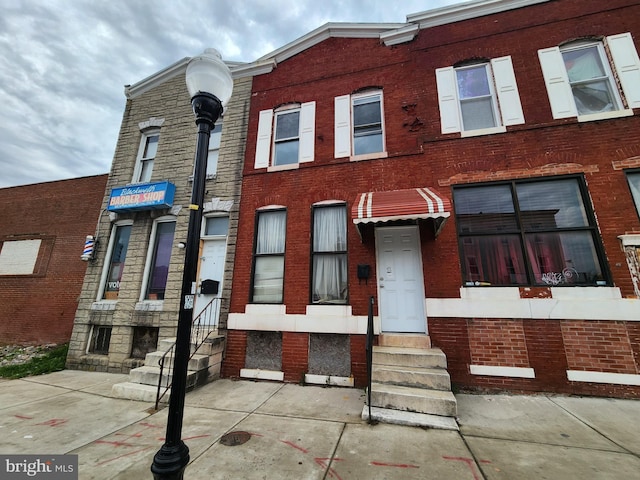 2932 Greenmount Ave, Baltimore, MD 21218 - view of property featuring brick siding and entry steps