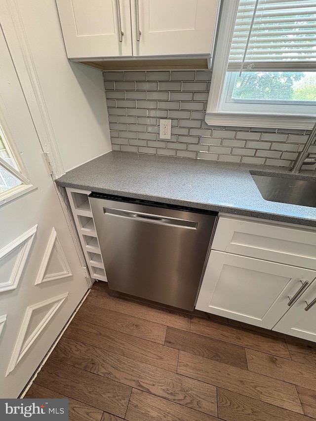 7915 New Second St, Elkins Park, PA 19027 - kitchen view of stainless steel dishwasher, white cabinetry, dark wood-type flooring, tasteful backsplash, and a sink