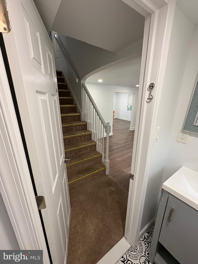 7915 New Second St, Elkins Park, PA 19027 - stairs with recessed lighting, wood finished floors, and arched walkways