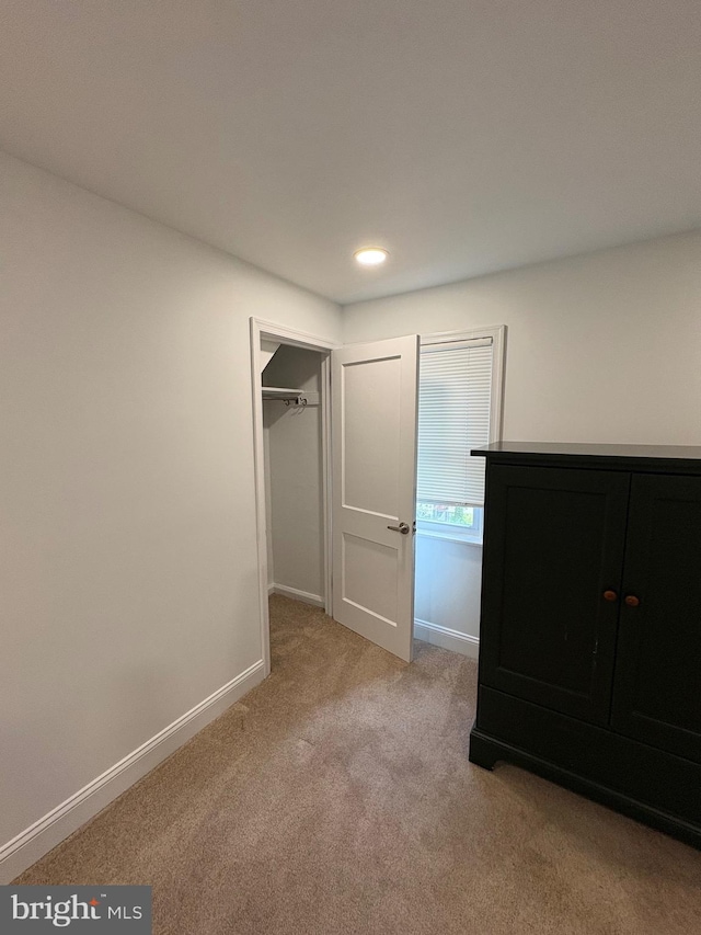 7915 New Second St, Elkins Park, PA 19027 - unfurnished bedroom featuring light colored carpet, baseboards, recessed lighting, a closet, and a walk in closet