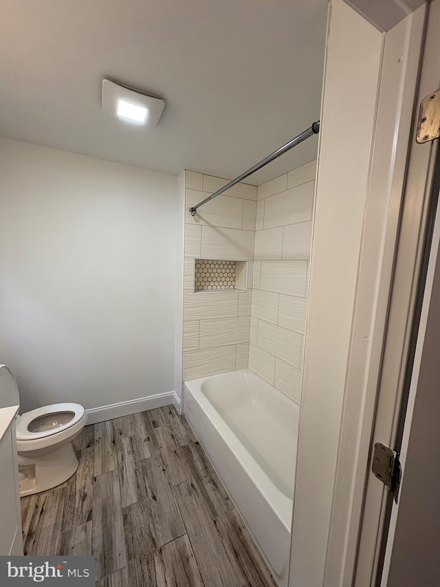 7915 New Second St, Elkins Park, PA 19027 - full bath featuring toilet, wood finished floors, shower / bathtub combination, baseboards, and vanity