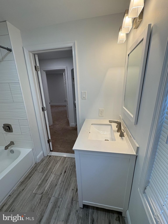 7915 New Second St, Elkins Park, PA 19027 - full bathroom with vanity, wood finished floors, bathtub / shower combination, and baseboards