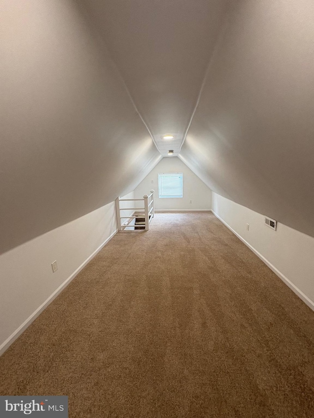 7915 New Second St, Elkins Park, PA 19027 - additional living space with baseboards, vaulted ceiling, and carpet floors