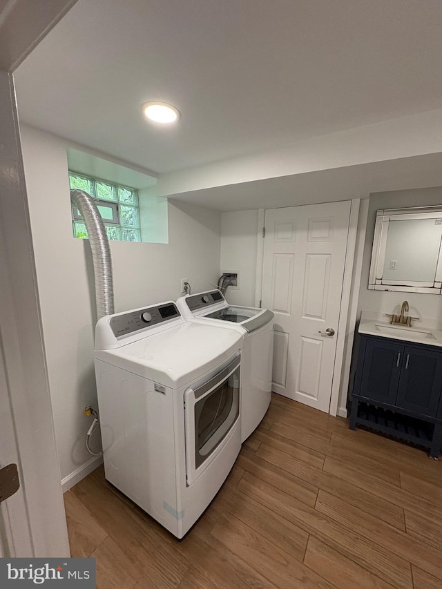 7915 New Second St, Elkins Park, PA 19027 - washroom featuring washing machine and clothes dryer and light wood-style floors