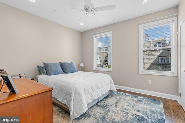 bedroom featuring baseboards, recessed lighting, wood finished floors, and a ceiling fan