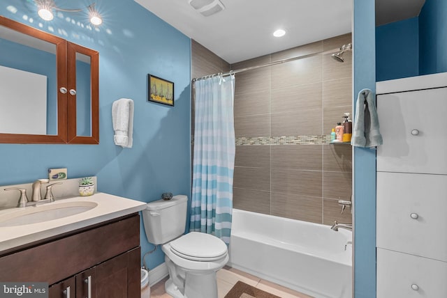 full bathroom featuring visible vents, shower / tub combo with curtain, toilet, vanity, and tile patterned flooring