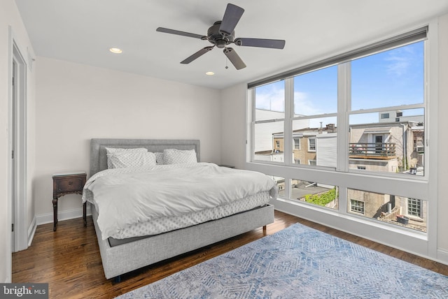 bedroom featuring recessed lighting, ceiling fan, wood finished floors, and baseboards