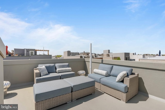 view of patio with an outdoor living space and a balcony