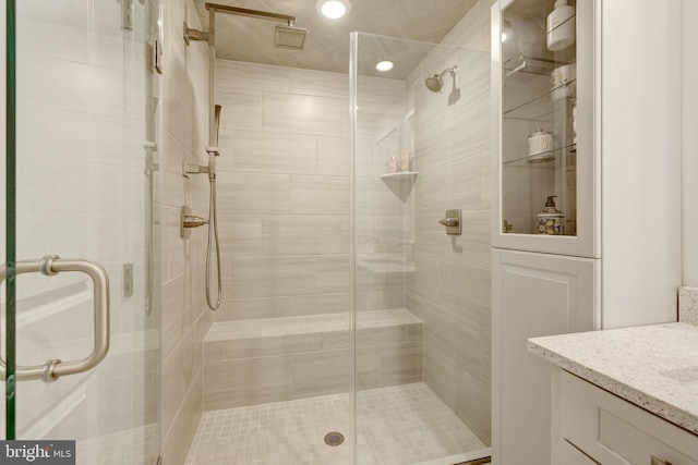 full bath featuring a shower stall and vanity