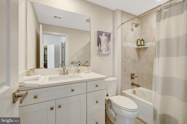 full bathroom with shower / bath combo, toilet, and vanity