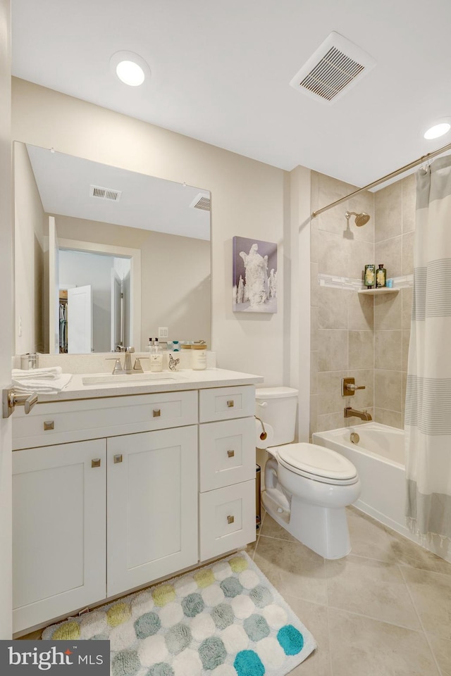 full bath with tile patterned floors, toilet, shower / bath combo, and vanity