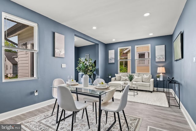 dining area with recessed lighting, wood finished floors, and baseboards