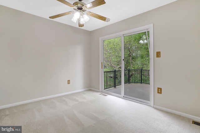 empty room with baseboards, light carpet, and ceiling fan
