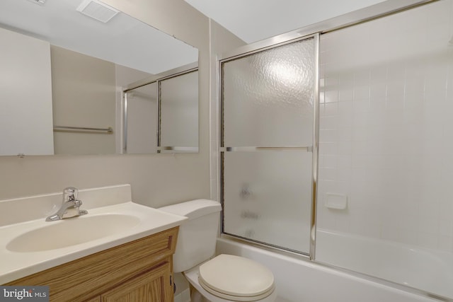 full bath featuring vanity, toilet, shower / bath combination with glass door, and visible vents