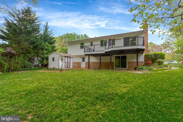 back of property with a lawn, a wooden deck, a chimney, and brick siding