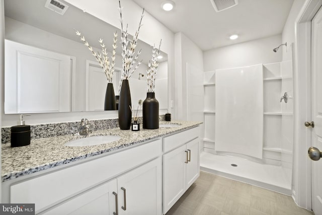 111 Yurok Ct, Winchester, VA 22602 - bathroom with walk in shower, visible vents, and vanity