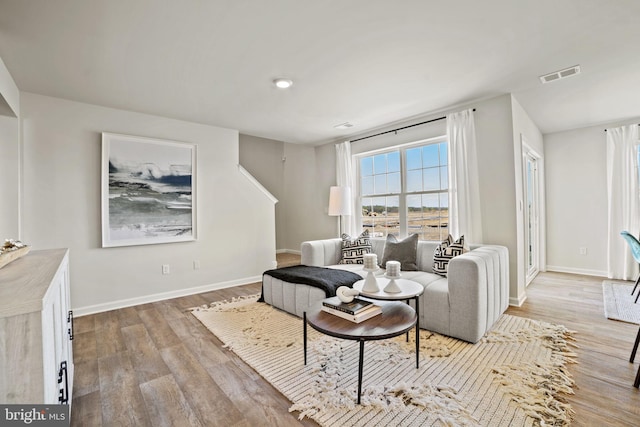111 Yurok Ct, Winchester, VA 22602 - living area with baseboards, wood finished floors, and visible vents