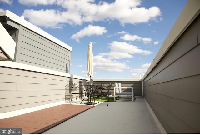 view of patio / terrace with a balcony