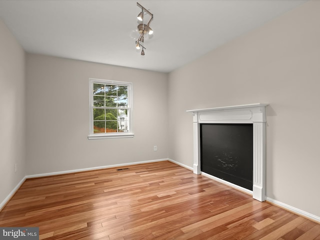3826 Perryhurst, Nottingham, MD 21236 - unfurnished living room with wood finished floors and baseboards