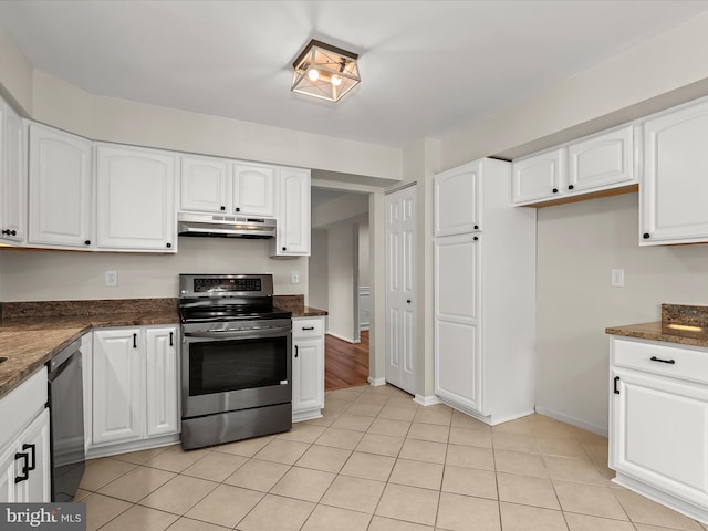 3826 Perryhurst, Nottingham, MD 21236 - kitchen featuring appliances with stainless steel finishes, under cabinet range hood, white cabinets, dark stone countertops, and light tile patterned floors