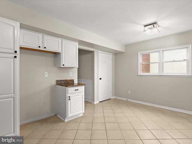 3826 Perryhurst, Nottingham, MD 21236 - kitchen with white cabinetry, baseboards, and light tile patterned floors