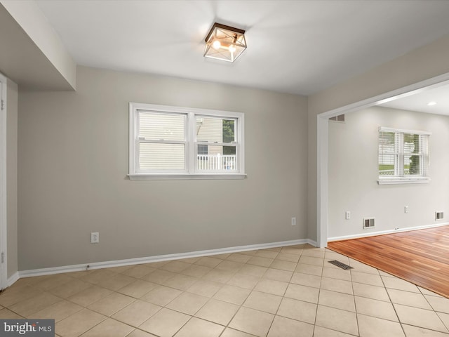 3826 Perryhurst, Nottingham, MD 21236 - spare room with healthy amount of natural light, light tile patterned floors, and baseboards