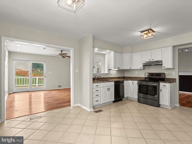 3826 Perryhurst, Nottingham, MD 21236 - kitchen with stainless steel electric range oven, under cabinet range hood, black dishwasher, dark countertops, and a sink
