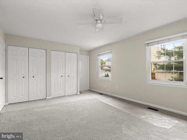 3826 Perryhurst, Nottingham, MD 21236 - unfurnished bedroom with baseboards, multiple closets, and a ceiling fan