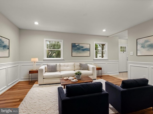 3826 Perryhurst, Nottingham, MD 21236 - living area with plenty of natural light, light wood-style floors, a decorative wall, wainscoting, and recessed lighting