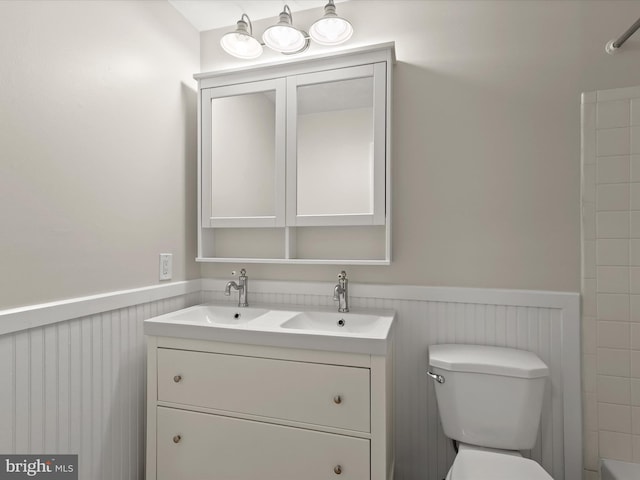 3826 Perryhurst, Nottingham, MD 21236 - bathroom with wainscoting, double vanity, toilet, and shower / washtub combination
