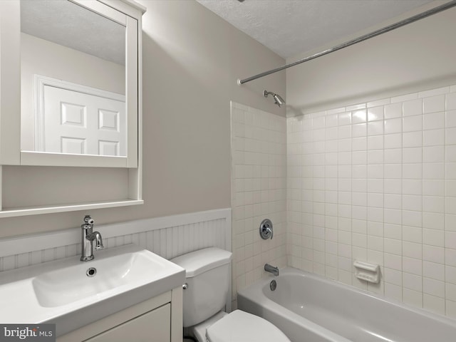 3826 Perryhurst, Nottingham, MD 21236 - full bath featuring toilet, washtub / shower combination, vanity, a textured ceiling, and a wainscoted wall