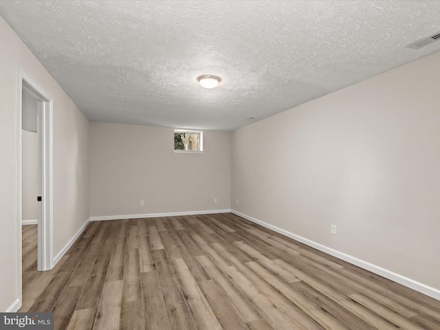 3826 Perryhurst, Nottingham, MD 21236 - basement featuring wood finished floors, a textured ceiling, and baseboards