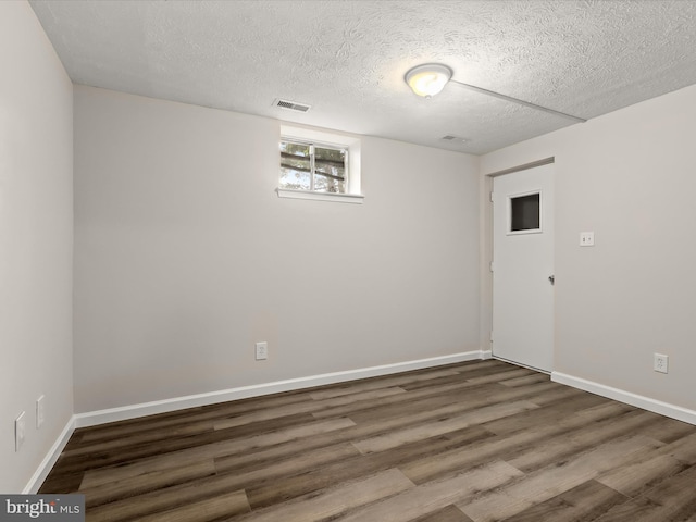 3826 Perryhurst, Nottingham, MD 21236 - empty room with wood finished floors, a textured ceiling, and baseboards