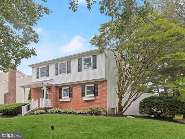 3826 Perryhurst, Nottingham, MD 21236 - view of front of property featuring brick siding and a front yard